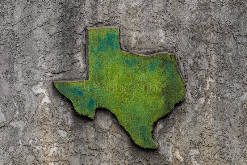 Texas shaped grunge rough textured concrete decoration on stone wall.  royalty free stock images
